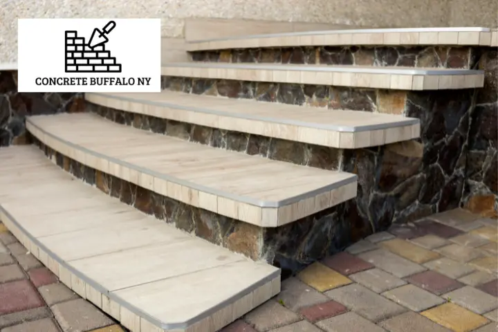 Renovated concrete staircase with a smooth finish and safety railings in Buffalo, NY.